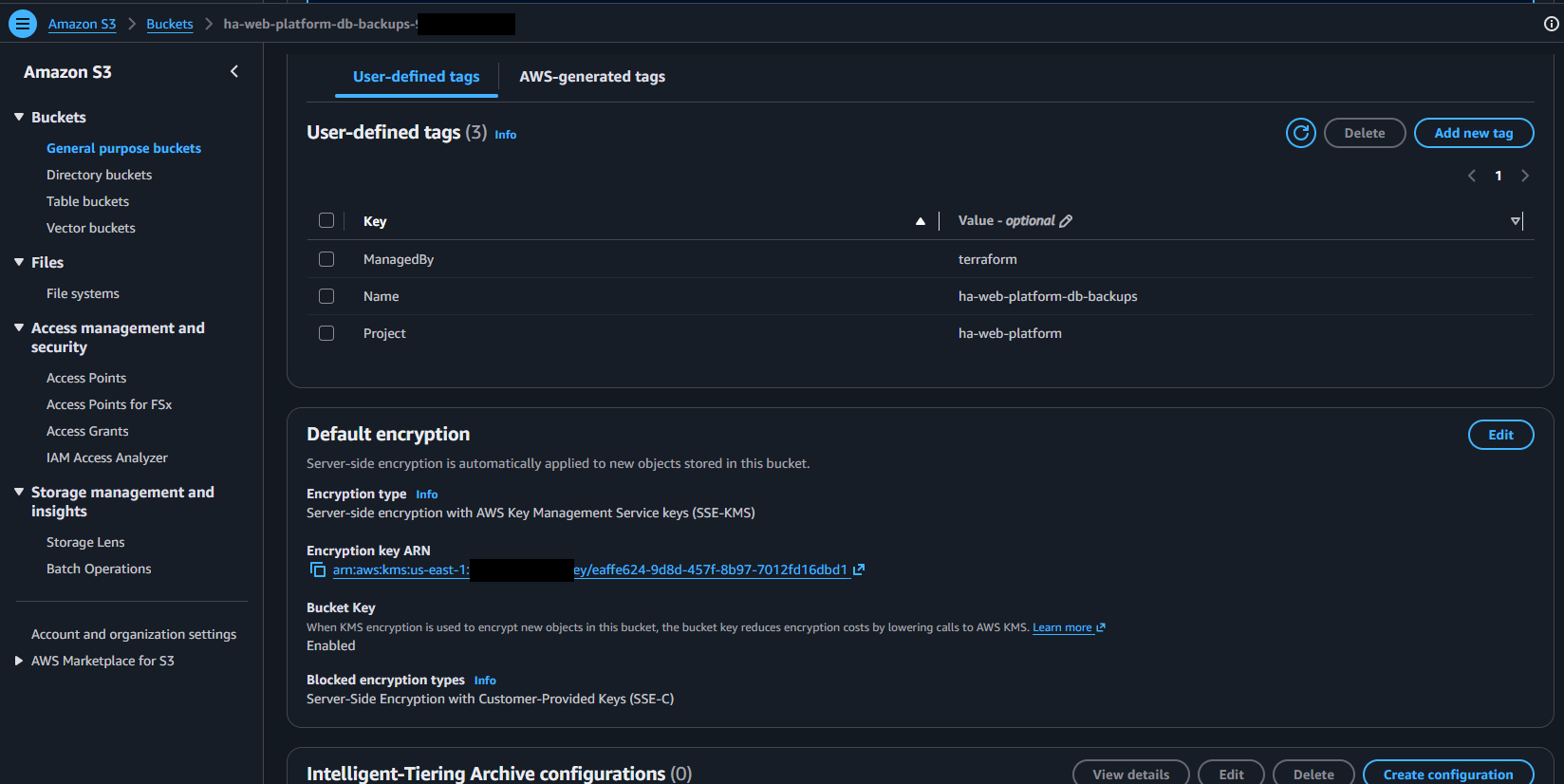 S3 default encryption panel showing SSE-KMS with a customer-managed key ARN, bucket key enabled, and Terraform-applied tags. The account identifier is redacted from the ARN.