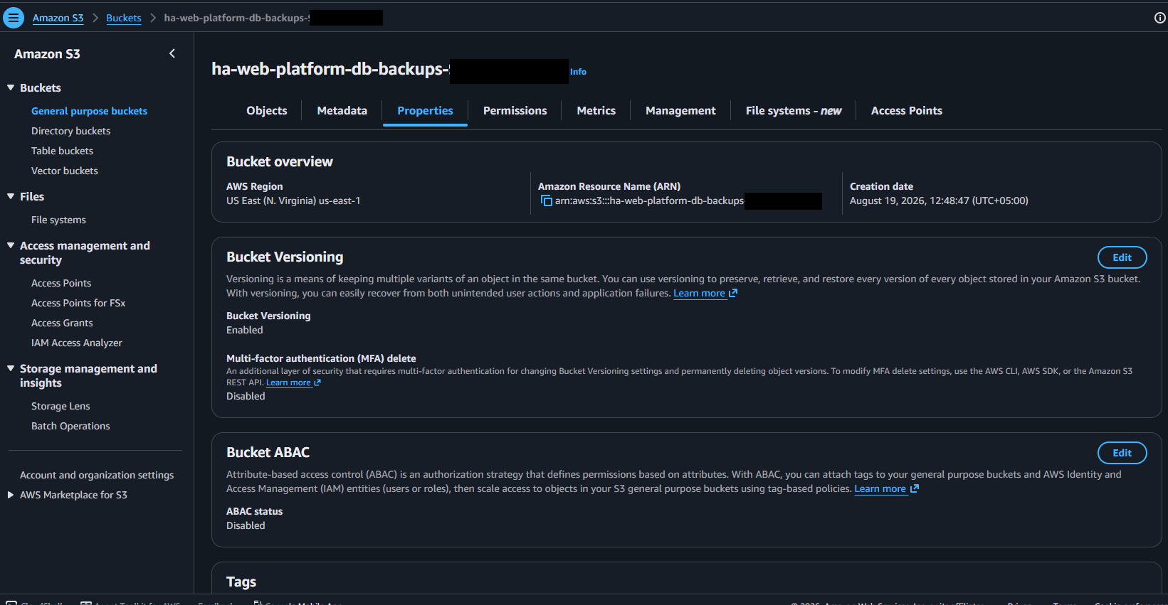S3 bucket properties page showing Bucket Versioning enabled, with the AWS account identifier redacted from the bucket name, title and ARN.